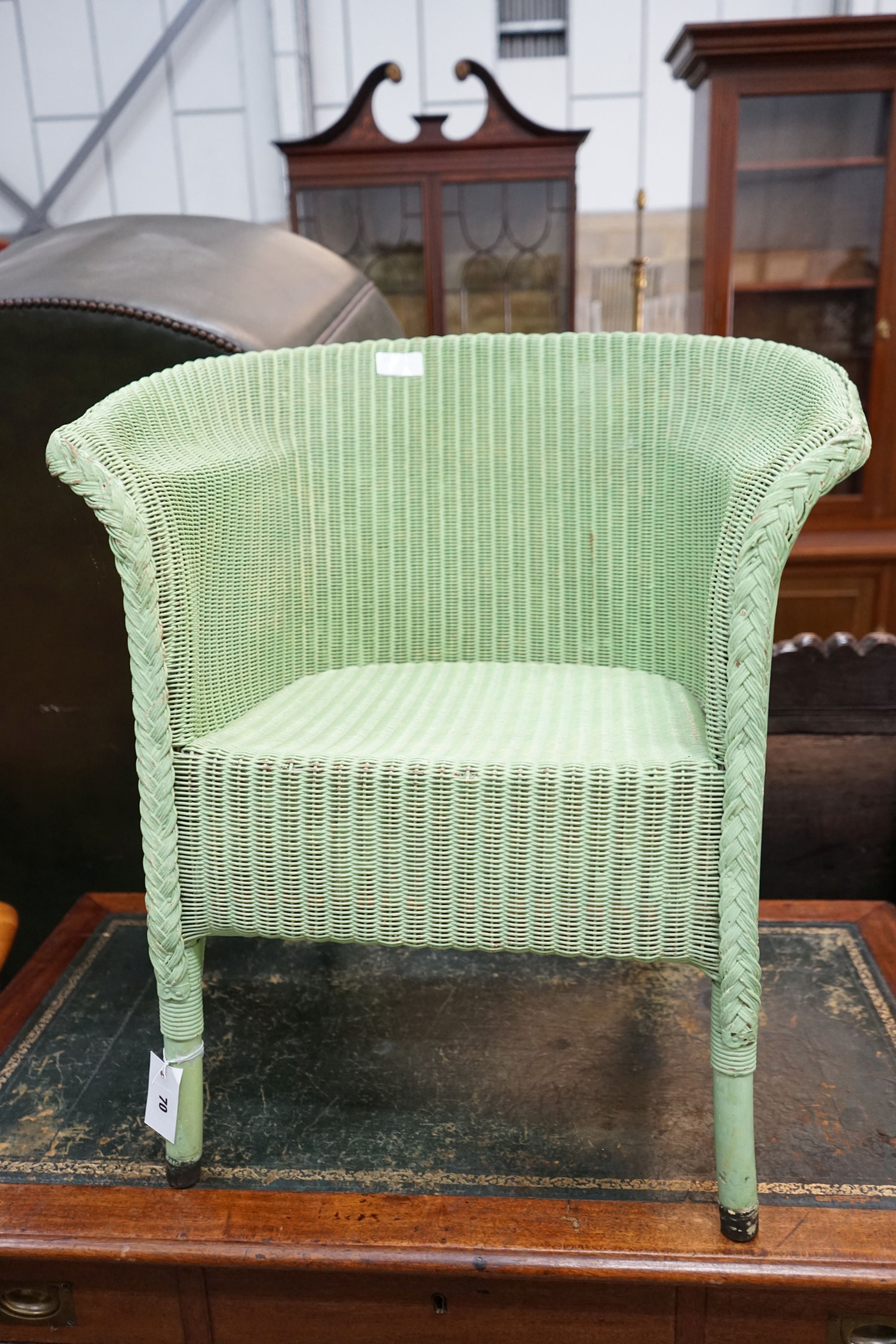 A Lloyd Loom elbow chair, later painted